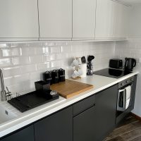The Kitchen: stocked with kettle, toaster, microwave, stove, hob, tea, coffee, sugar, cooking essentials, dishwasher and fridge